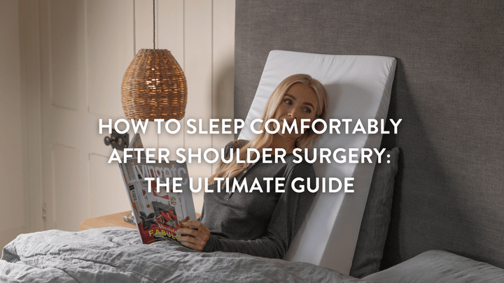Person sitting up in bed using the bedwedge.com bed wedge pillow for support