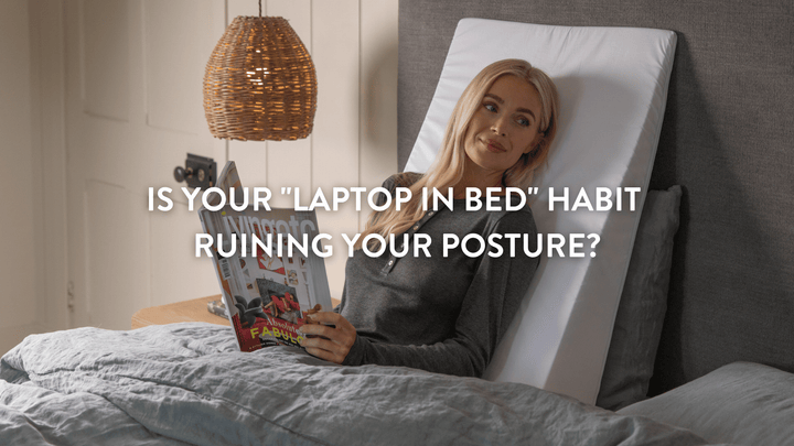 Woman using an ergonomic bed wedge for reading in bed to prevent back pain