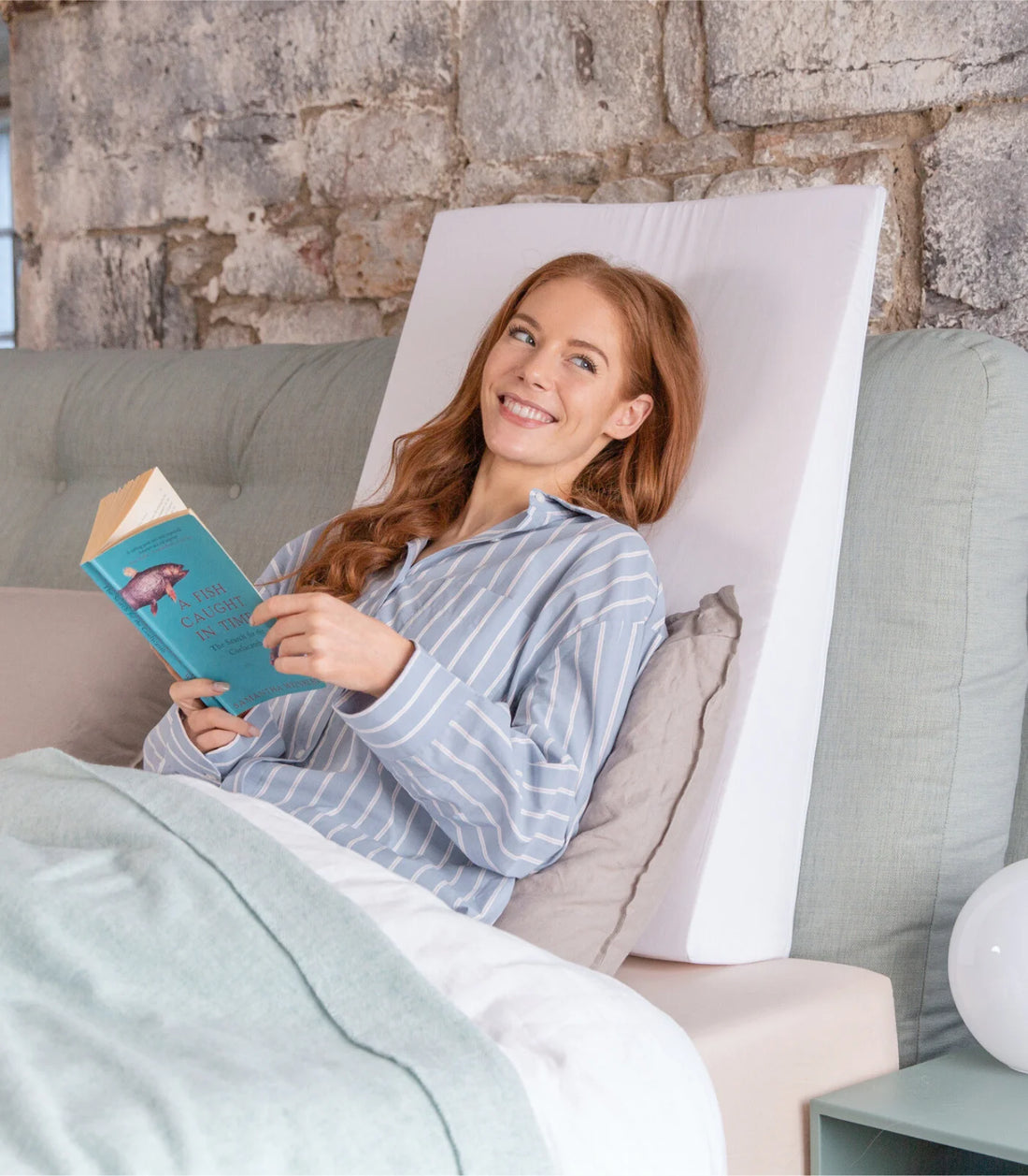using a bed wedge pillow to sit upright in bed for reading eating watching TV